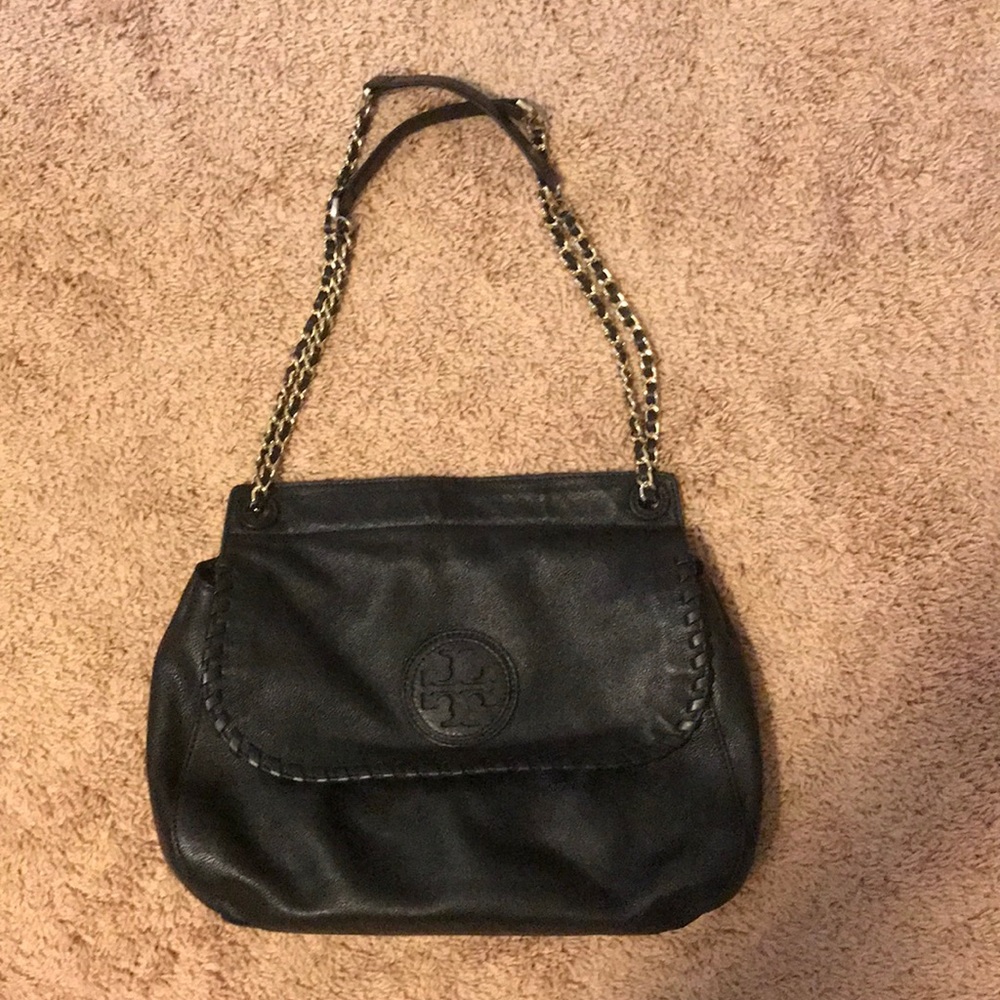 Black leather Tory Burch purse with gold chain.